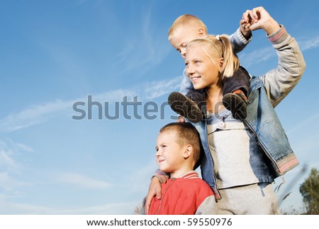 Happy Family.Healthy Kids Having Fun Outdoor.Over Blue Clear Sky