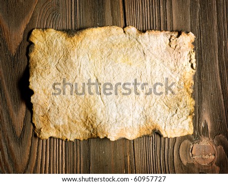 Old Paper sheet over wooden background
