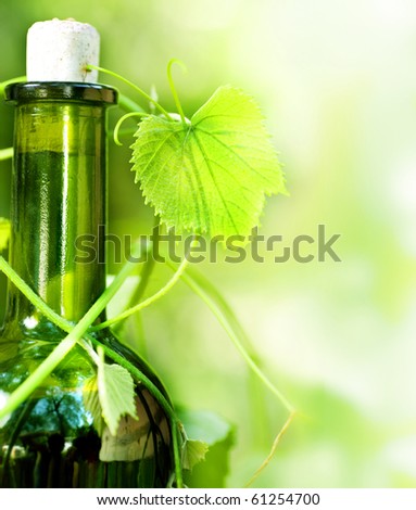 Bottle of Wine and grape leaves