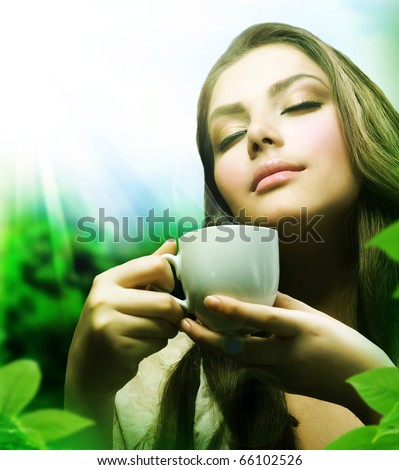 Beautiful Girl Drinking Healthy Green Tea.Healthcare or Herbal medicine concept - stock photo