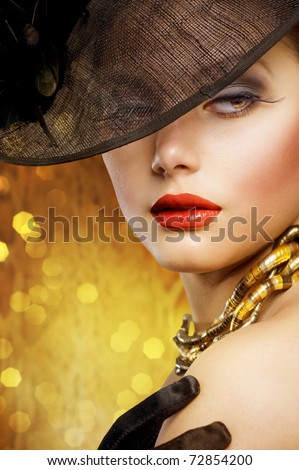 Beautiful Woman over luxury gold background