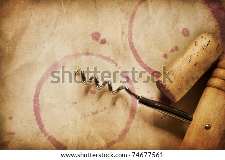 Wine Background. Wine Cork, Corkscrew and red wine stains on the vintage paper