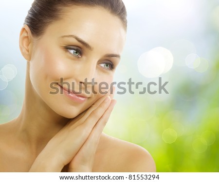 Beautiful Healthy Woman over Nature background.Perfect Healthy skin