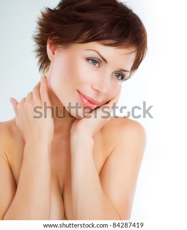 Beautiful Young Woman touching her Face. Skincare .Perfect Skin