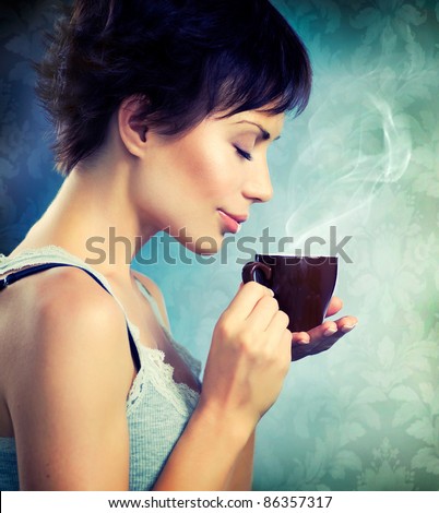 Beauty Girl With Cup of Coffee