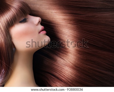 Brown Hair. Beautiful Woman with Healthy Long Hair