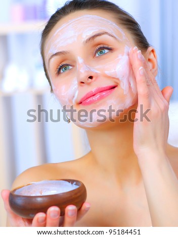 stock photo Beautiful Woman Applying Natural Homemade Facial Mask