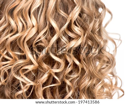 Curly blonde hair closeup. Wavy blond hair background. Close up texture of permed hair. Hairstyle