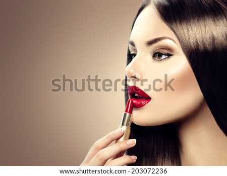 Lipstick. Professional Lips Make-up. Lipgloss. Beauty Girl Applying Lip stick