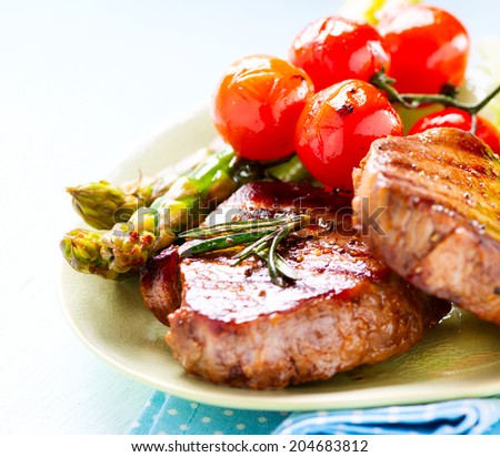 Grilled Beef Steak Meat with Asparagus and Cherry Tomato. Steak Dinner. Food. BBQ Grill. Berbeque. Barbecue