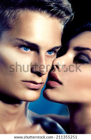 Beautiful sexy couple portrait. Model man and beauty young woman kissing. Love. Passion. Lovers