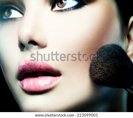 Makeup. Make-up Face. Big Make up brush. Beauty Woman. Makeup applying. Beautiful fashion model girl face closeup.