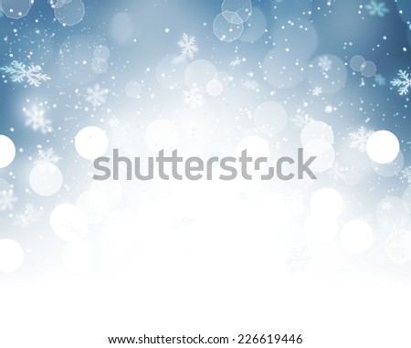 Christmas Background. Winter Holiday Snow Blue Background with snowflakes and stars. Christmas Abstract Defocused Blurred Glowing Backdrop. Elegant Bokeh
