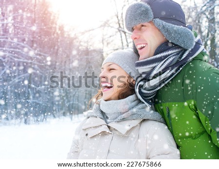 Winter couple. Happy Couple Having Fun Outdoors. Snow. Winter Vacation. Outdoor