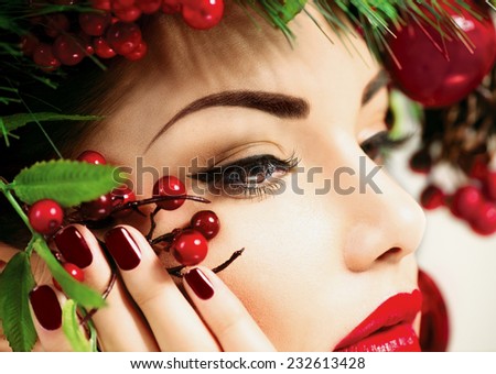 Christmas make up. Holiday New Year Makeup and manicure closeup. Beauty Woman face close up