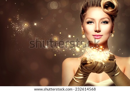 Holiday Retro Woman with magic in her hand. Beauty Fashion Christmas Vintage Style Lady with Beautiful Luxury Hairstyle, makeup, accessories. Golden Silk Gloves and dress