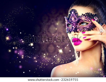 Sexy model woman wearing venetian masquerade carnival mask at party over holiday dark background. Christmas and New Year celebration. Sexy girl with holiday makeup and manicure. Purple lips and nails
