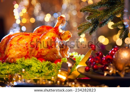 Christmas table setting with turkey. Christmas dinner. Holiday decorated table, Christmas tree, champagne and roasted turkey, Christmas served table