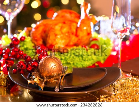 Christmas table setting with turkey. Christmas dinner. Holiday decorated table, Christmas tree, champagne and roasted turkey, Christmas served table