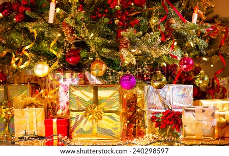 Decorated New Year tree with various gifts. Christmas and New Year celebration. Holiday scene. Christmas gifts under the Christmas tree