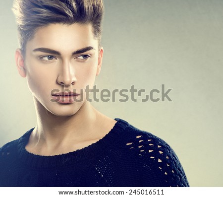 Fashion young model man portrait. Handsome Guy. Vogue style image of elegant young man