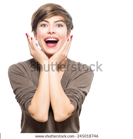 Surprised woman. Young emotional beauty woman looking excited. Isolated on white background. Broadly smiling modern girl with shot brown hair expressing positive surprised emotions, smile with teeth.