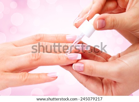 Manicure, Hands spa Cuticle oil. Beautiful Woman hands closeup. Manicured nails and Soft skin. Beauty hands. Beauty treatment. Beautiful woman\'s nails with beautiful french manicure