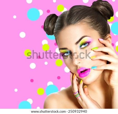 Beauty Girl Portrait with Colorful Makeup, Nail polish and ring Accessories. Colourful eyeshadows make-up. Studio Shot of Stylish Woman. Vivid Colors. Manicure and Hairstyle. Rainbow Colours