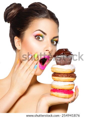 Beauty fashion model girl taking colorful donuts. Surprised Funny joyful woman with sweets, dessert. Diet, dieting concept. Junk food, Slimming, weight loss. Isolated on white background