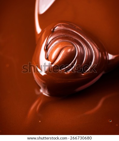 Chocolate praline. Chocolates background. Chocolate. Liquid chocolate. dark and milk chocolate. Sweets