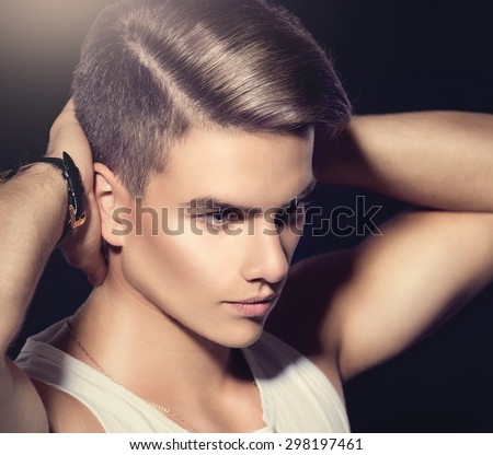 Handsome young man. Fashion young model man portrait. Handsome Guy. Vogue style image of elegant boy. fashion Hairstyle, haircut.