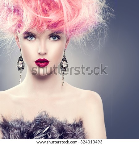 High Fashion Model Girl with Updo hairstyle and stylish makeup. Beauty woman with glamour hairdo hair style and accessories. Beauty Lady in fur coat portrait