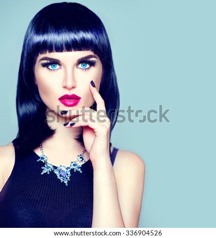 High Fashion Model Girl Portrait with Trendy fringe Hair style, Make up and Manicure. Black Hairstyle, Black Nail Polish and purple Lipstick. Woman Makeup. Sexy Lips. Bob Haircut