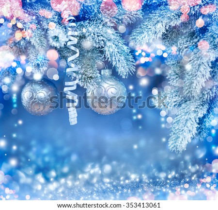 Christmas Holiday Background, Hanging baubles on Christmas tree, New Year backdrop with snow. Decoration. Abstract Blurred Blue Bokeh, Blinking Garland. Christmas Tree decorated, Lights Twinkling