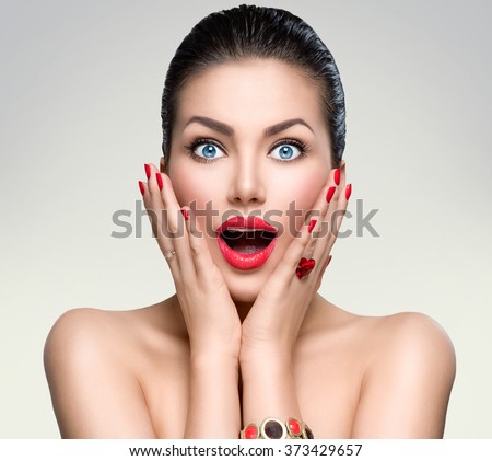 Beauty Fashion surprised Woman portrait. Beautiful model girl with perfect make up exited, screaming and open and mouth. Emotions. Isolated on a white background