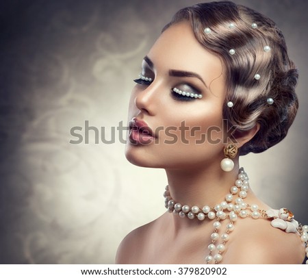 Retro Styled Makeup With Pearls. Beautiful Young Woman Portrait with pearl jewellery, earrings, necklace and make up. Romantic lady face closeup. Old Fashioned Makeup and Finger Wave Hairstyle