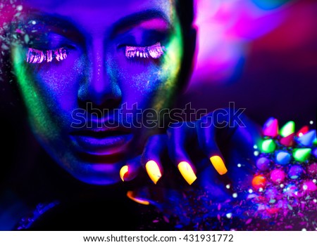 Fashion model woman in neon light, portrait of beautiful model girl with fluorescent make-up, Art design of female disco dancer posing in UV, colorful make up. Isolated on black background