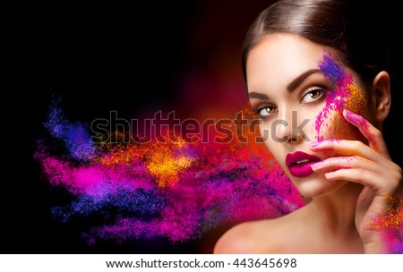 Fashion model girl portrait with colorful powder make up. Beauty woman with bright color makeup. Close-up of Vogue style lady face, Abstract colourful make-up, Art design. Black background
