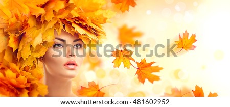 Autumn Woman, Fall. Beauty model girl with autumn bright leaves hairstyle. Beautiful Fashion female with Autumnal Make up and Hair style. Creative Autumn Makeup. Beautiful Face