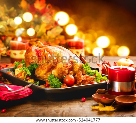 Christmas Turkey Dinner. Roasted Turkey. Winter Holiday table served, decorated with candles. Roasted chicken, table setting.