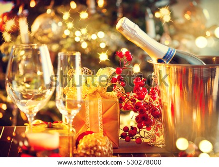 Christmas And New Year Holiday Table Setting with Champagne. Celebration. Place setting for Christmas Dinner. Holiday Decorations. Decor. Served Table.