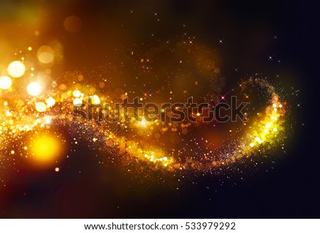 Golden Christmas and New Year glittering stars swirl on black bokeh background. backdrop with sparkling golden stars, holiday garland, magic glowing dust, lights. Gold Abstract Glitter Blinking sparks