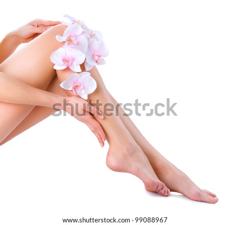 Healthy Legs Spa Skincare Long woman legs and Hands isolated on white Healthy Legs Spa Skincare Long woman legs and Hands isolated on white
