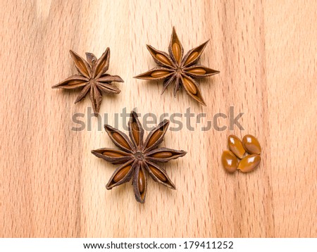 Star anise on a wooden background, also known as star aniseed or Chinese star anise