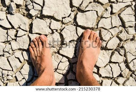 Naked feet on dry land