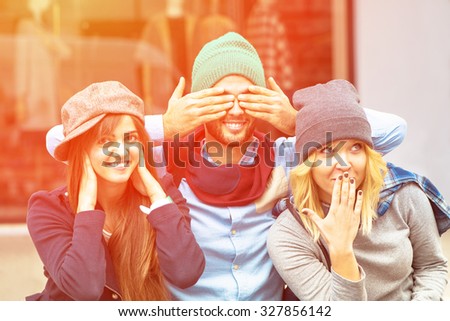 See no Evil, Hear no Evil, Speak no Evil, close-up portrait - Hipster happy friends enjoy a afternoon in the city with funny faces - Friendship of young people having fun together with vintage look