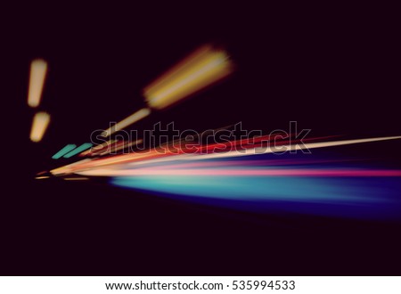 Blurry Illumination and night lights, car traffic motion blur the speed and dynamics