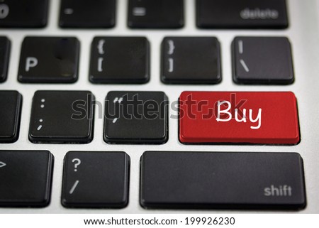 Black keyboard with word Buy   on the red keyboard key