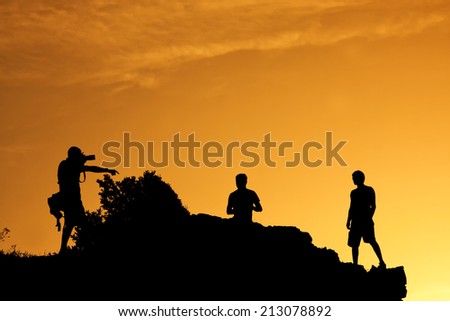 Photographer taking picture on a hill
