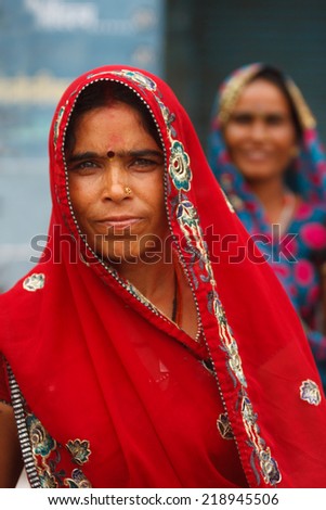 AGRA,INDIA - 24/03/2013 : Unidentified Indian women with traditional and colorful scarfs.Scarf  made of indian silk  is very common and popular among Indian woman,.